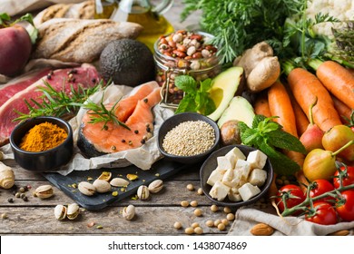 Balanced nutrition concept for clean eating flexitarian mediterranean diet. Assortment of healthy food ingredients for cooking on a wooden kitchen table. - Shutterstock ID 1438074869