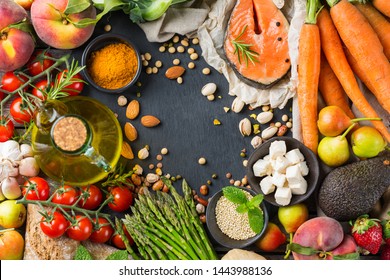 Balanced nutrition concept for clean eating flexitarian meditteranean diet. Assortment of healthy food ingredients for cooking on a kitchen table. Top view flat lay background - Shutterstock ID 1443988136