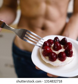 Balanced Nutrition, Diet, Sugar Free Dessert, Healthy Food. Young Sporty Man With Muscle Body Eating Tasty Berry Cake