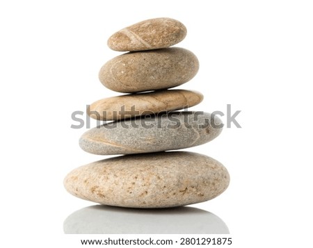 A balanced stack of five smooth river stones forming a zen cairn with subtle reflections. This commercial stock asset, reference ultra-realistic-smooth-river-stone-stack-isolated-.jpg, features natural pebbles isolated on a transparent background.