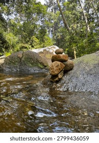 Balanced Stone Stack on River Rock in Tropical Forest Stream