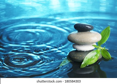 Balanced stones in water - Powered by Shutterstock