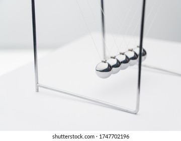 Balancing Balls On A White Background. Business Concept. Newtons Cradle