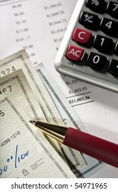 Balancing Checkbook. Close Up Of Checks,pen And Calculator.