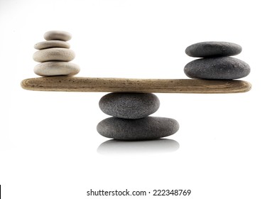 balancing stones on white background
