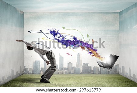 Balancing young man evading from explosion of ideas