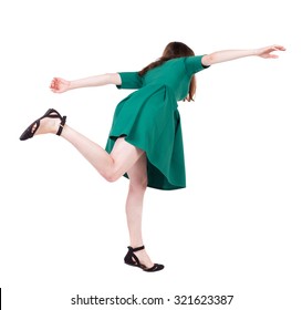 Balancing young woman.  or dodge falling woman. Rear view people collection.  backside view of person.  Isolated over white background. Girl in green short dress falls forward.