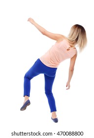 Balancing young woman.  or dodge falling woman. Rear view people collection.  backside view of person.  Isolated over white background. The blonde in a pink shirt and slipped down.