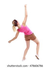 Balancing Young Woman. Or Dodge Falling Woman. Isolated Over White Background. Sport Blond In Brown Shorts Falls On His Back.