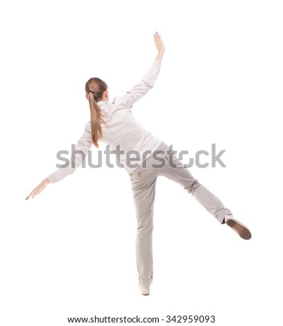 Balancing young woman.  or dodge falling woman. Rear view people collection.  .  Isolated over white background. Girl with long hair in a white jacket falls on the side, razmahvaya hands.