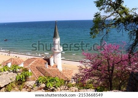  Balchik Palace Castle of Romanian Queen Marie at Bulgarian Black Sea coast. Beautiful romantic garden with colorful flowers.