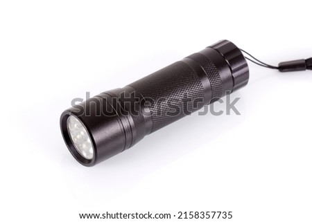 Balck flashlight, white background, isolated