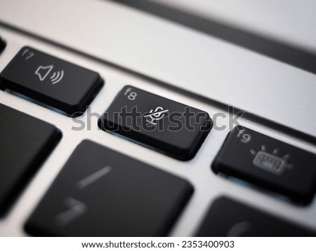 balck mute key closeup on a laptop keayboard