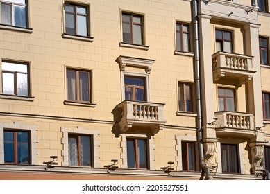 Balcony With With Balustrade, Old Residential Building. Stalinist Architecture, Building On Independence Avenue In Minsk. Stalin Empire Style. Balcony Of Soviet Building
