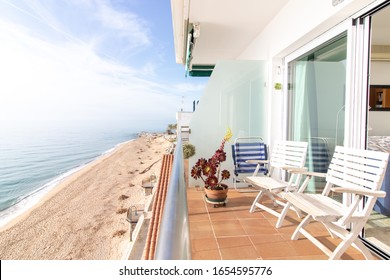 balcony with chairs by the sea