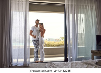 Balcony, coffee and hug with couple in hotel room together for holiday, travel or vacation. Love, morning view or summer with happy man and woman in home for anniversary, honeymoon or bonding - Powered by Shutterstock