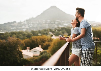 Balcony, couple and love in morning with coffee, expresso and warm beverage on vacation in Denmark. Outside, man and happy woman with laugh on honeymoon, marriage and bonding with hug by space - Powered by Shutterstock