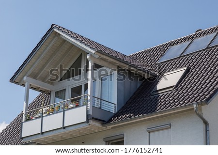 balcony with gable roof on residential building