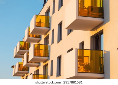 Balcony with a partition made of bright, colored glass. Modern architecture details - Powered by Shutterstock