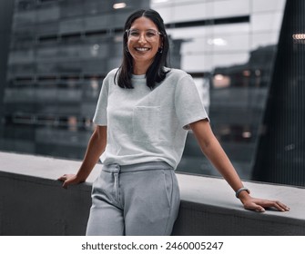 Balcony, portrait and smile of designer woman at office outdoor in city to relax for break. Design, glasses and business with happy employee in urban town for creative career as editor or publisher - Powered by Shutterstock