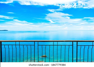 Balcony Railing On The High Cliff With Beautiful Endless Scenery Of Blue Sea And Cloudy Sky At Seaside Of Tropical Island. Seascape And Coastal Landscape At Lad Koh View Point, Samui Island, Thailand.