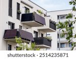 Balcony Solar Panels for Strata Apartment Buildings. Mini Solar Power Station on Balconies of Modern Apartment Bilding in Germany.