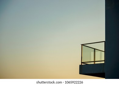 Balcony and sunset sky - Shutterstock ID 1065922226