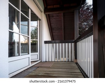 Balcony terrace with door and window, wood paneling