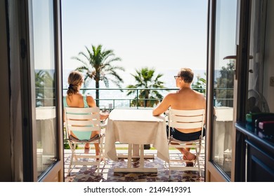 Balcony Or Terrace In A Sea View Room In Hotel Resort Or Villa. Couple On Vacation. Luxury Summer Holiday On Exotic Tropical Island Or Mediterranean City. People Enjoying Relaxing Family Getaway.