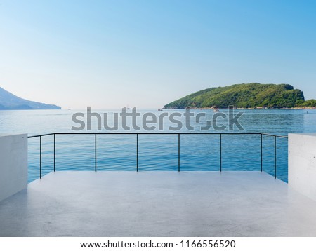 Balcony View Of Sea And Mountains Landscape During Sunny Day