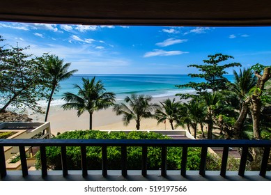 Balcony View Of Tropical Beach And Coconut Trees. Blue Sky. Amazing Ocean View.