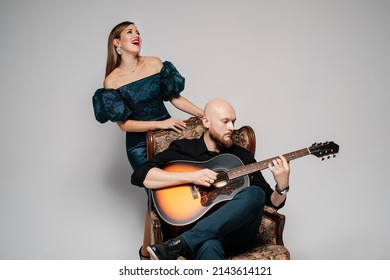 Bald Bearded Guy Plays The Guitar. The Woman Sings A Song. Acoustic Duet.