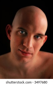 Bald is beautiful. A bald young man