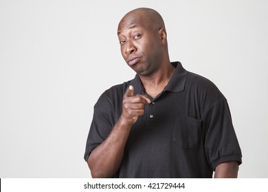 Bald Black Man With A Great Smile, Pointing At The Camera