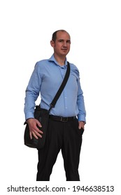 A Bald Guy Dressed In Blue Shirt And Black Pants Carrying A Bag With A Laptop Computer Isolated On White Background Slung Over His Shoulder. May Be An Office Worker Or Banker.