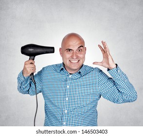 Bald Guy Holding Hair Dryer In His Hand