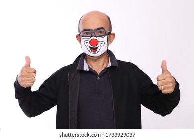 Bald Man With Funny Expression Wearing A Clown Face Protection Mask