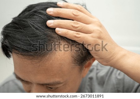 Bald in the middle head and begin no loss hair glabrous of mature Asian business smart active office man.