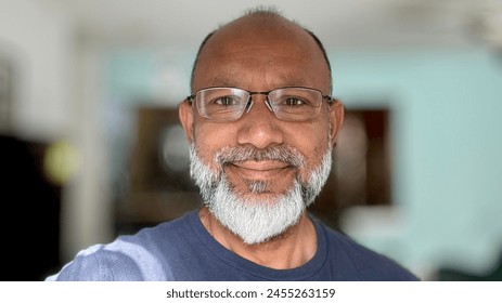 Bald old asian male with gray beard wearing prescription glasses posing for a selfie. - Powered by Shutterstock