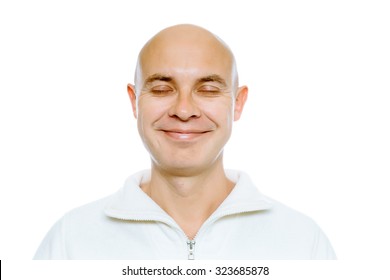 Bald Smiling Man With His Eyes Closed. Isolated On White. Studio