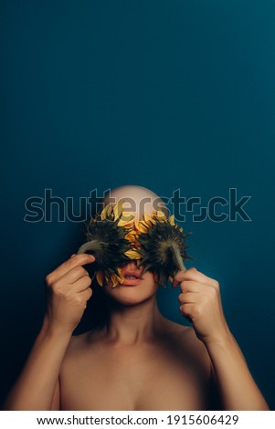 Similar – a girl with blue eyes and long hair with a beard of gerbera flowers