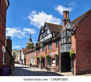 BALDOCK, HERTFORDSHIRE/UK - July 20, 2020. Sun Street (with The Victoria Public House And St Mary's Church Beyond), Baldock, Hertfordshire, England