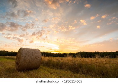 A Bale Of Straw Lying In The Field In The Sunset, Time Lapse