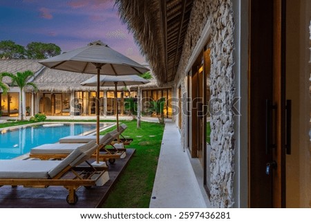 Balenese Pool Villa in Seminyak on the beautiful island of Bali colourful skies lush green tress Bali Indonesia