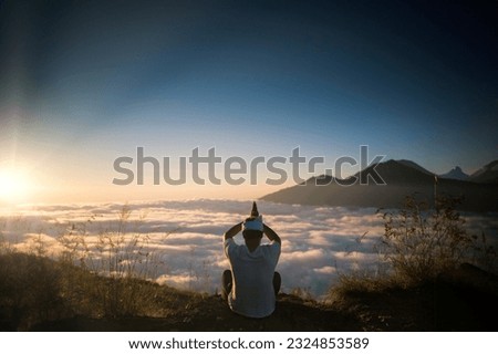 Bali Balinese or Java Javanese Hindu Religious Island Hinduism Prayer Outdoor Nature on top of Mountain during Sunrise