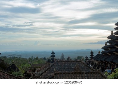 Bali, Indonesia - 08 March 2018: Pura Besakih temple complex, holiest of all Balinese Hindu temple. Summer landscape with religious buildings silhouette. Temples in sunset