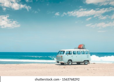 Bali, Indonesia, April 14 2018: Vintage volkswagen camper van parking at the beach with suitcases on top during on vacation in bali