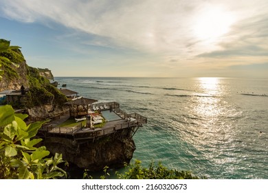 BALI, INDONESIA - April 2022: Villa with swimming pool on the cliff in Uluwatu beach, Bali, Indonesia