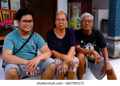 Bali, Indonesia, August 14, 2020: Portrait A Group Of Balinese Family Smiling Looking At The Camera.