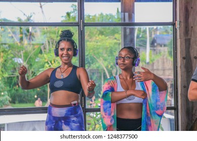 Bali, Indonesia - December 1, 2018: Two Black Women Wearing Headphones And Dancing At Silent Disco Dance Party 